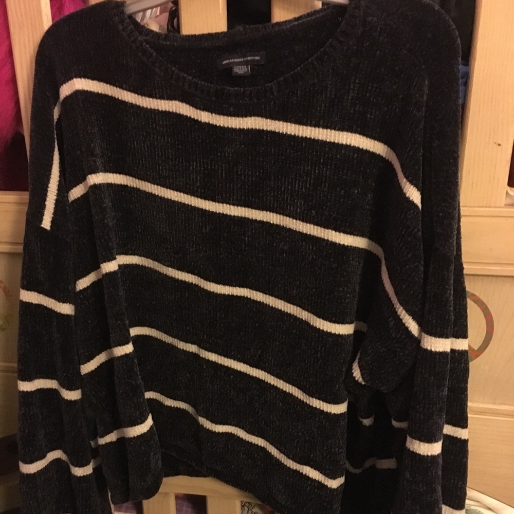A navy blue white striped chenille sweater